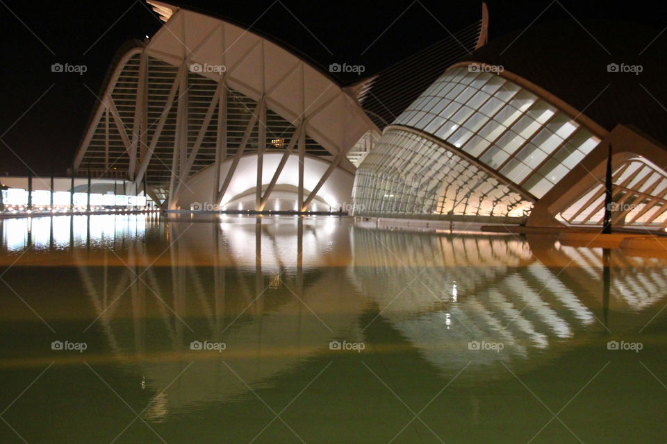 curved architecture reflection into the water