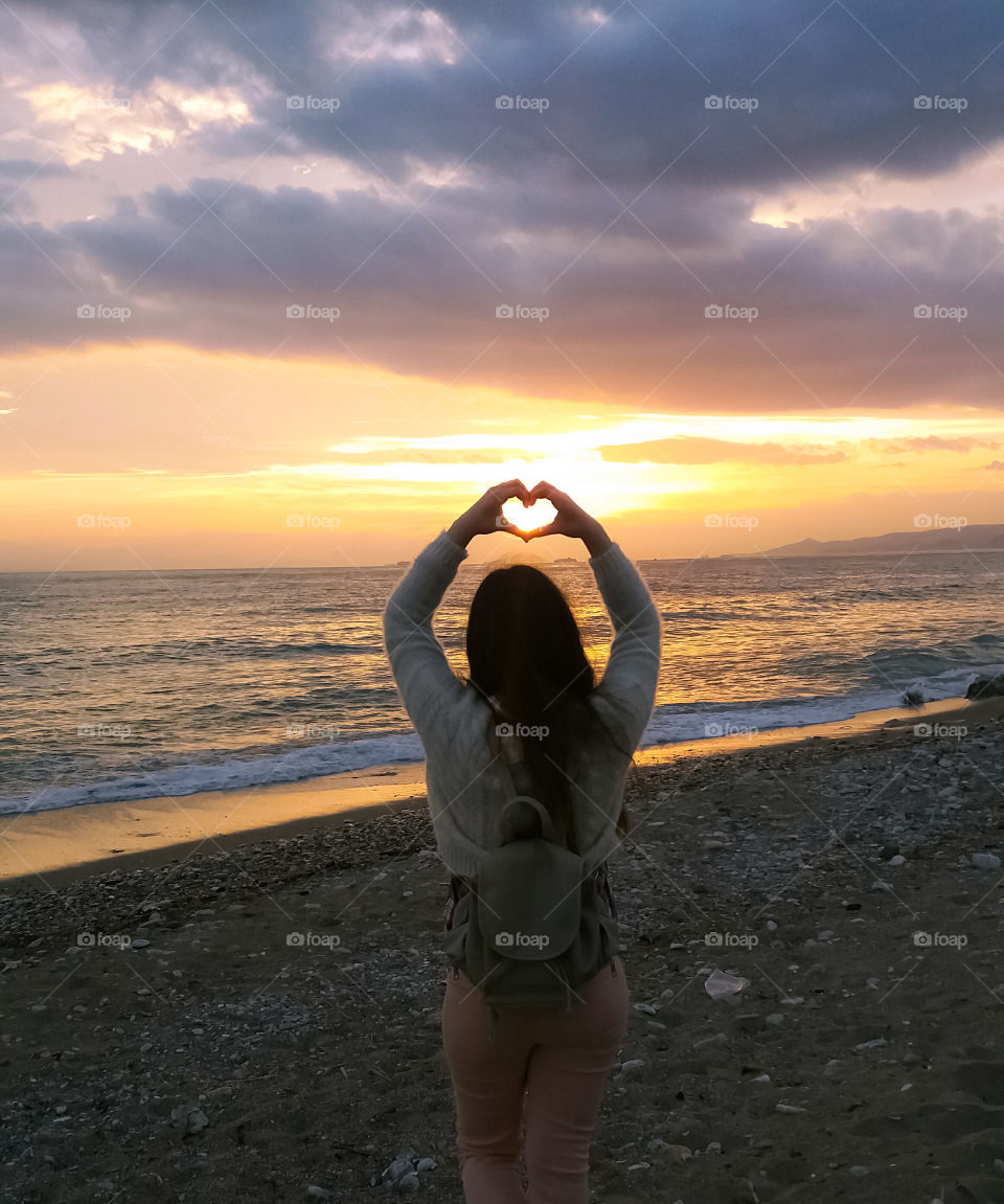 A girl showing her love for the sea.