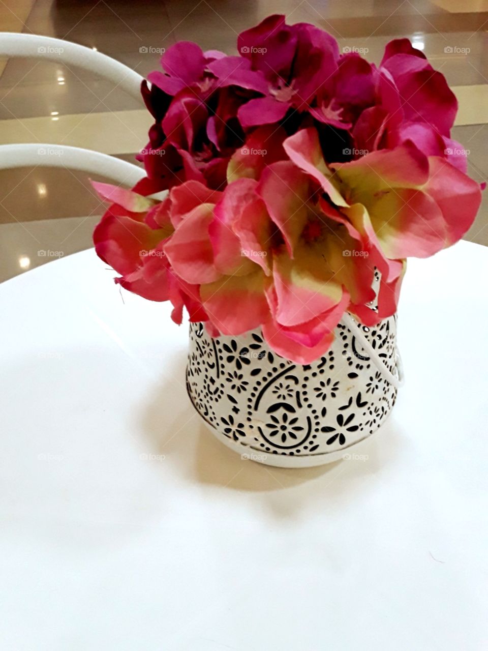 pink bunch of flowers on a white table