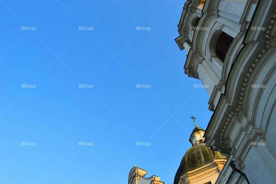 Clear blue sky above the historic basilica in Poland