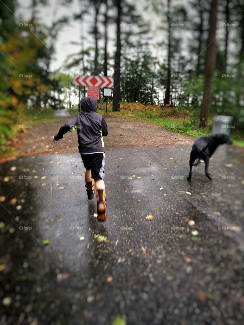 Boy running in the leaves 