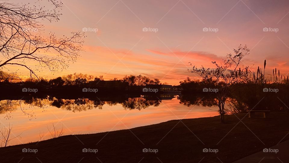 Twilight colors now appearing on the Evening Sky. Hues of Pink and Yellow reflecting off Lake Waters. 