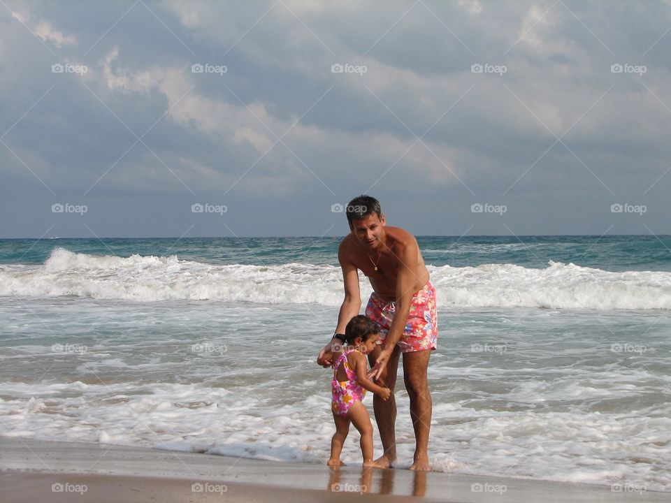 Small child playing seaside