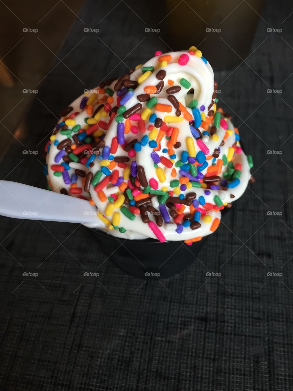 Rainbow sprinkles on ice cream 