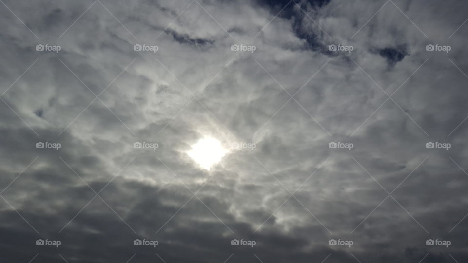 Chink of Sunlight Peeking Through Clouds