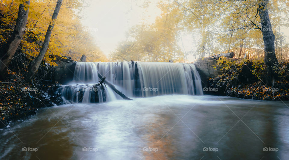 Waterfall in forest during autumn