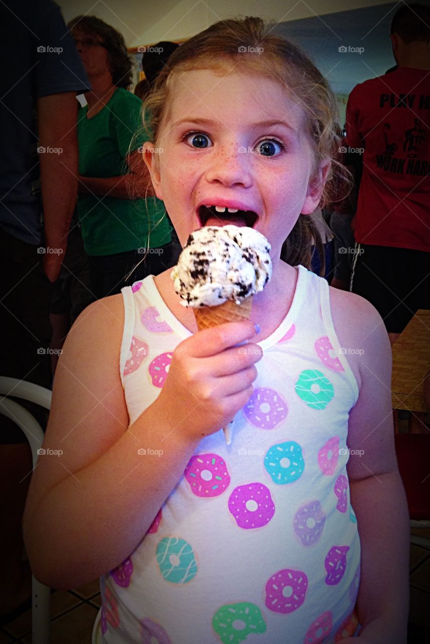 Cute girl eating ice-cream