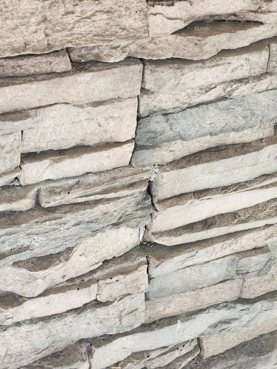 gray stacked stone column close up