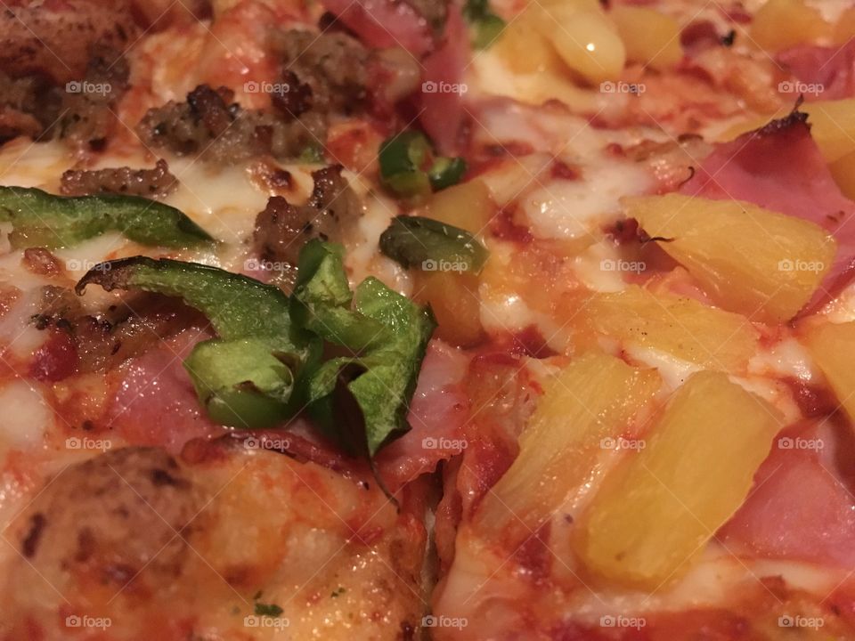 Delicious pizza! Take out/delivery. Pineapple on one half and sausage on the other