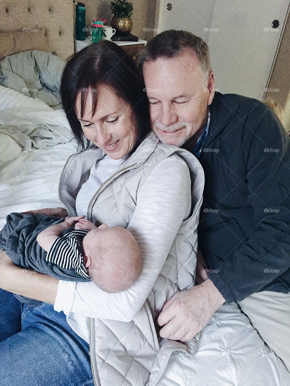 Grandma and grandpa meeting their first grandson for the first time