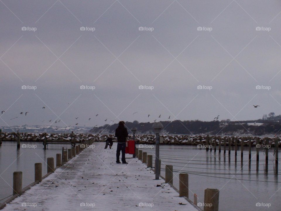 people on the pier in winter