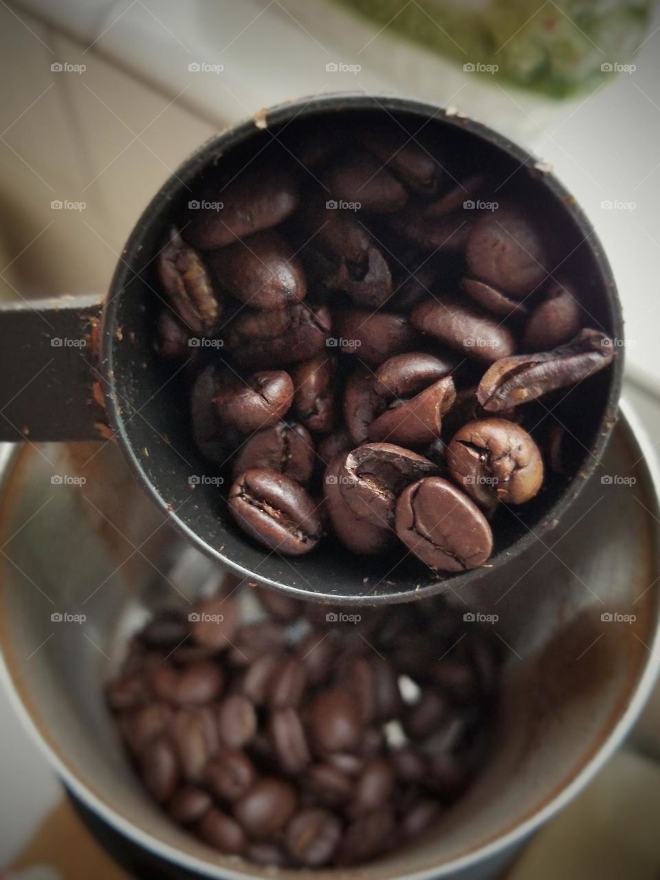 Close up of a scoop of coffee beans