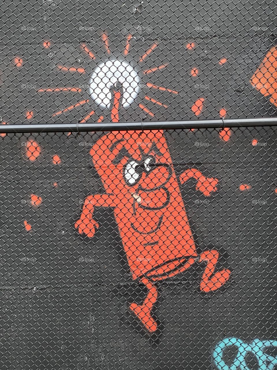 Dynamite man, behind fence.  Rory Staunton Playground, Jackson Heights, Queens, NYC