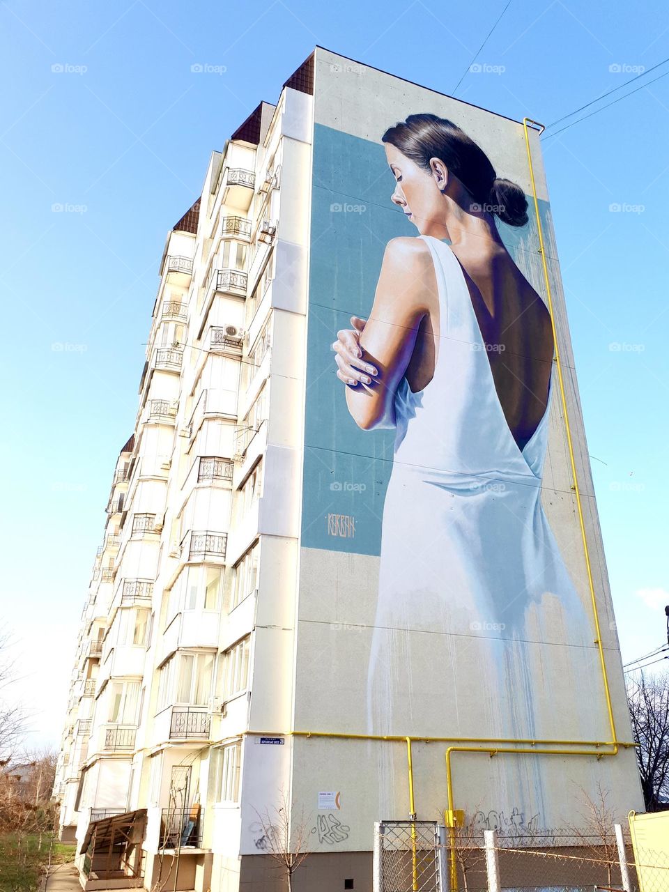Graffiti of woman in white dress 