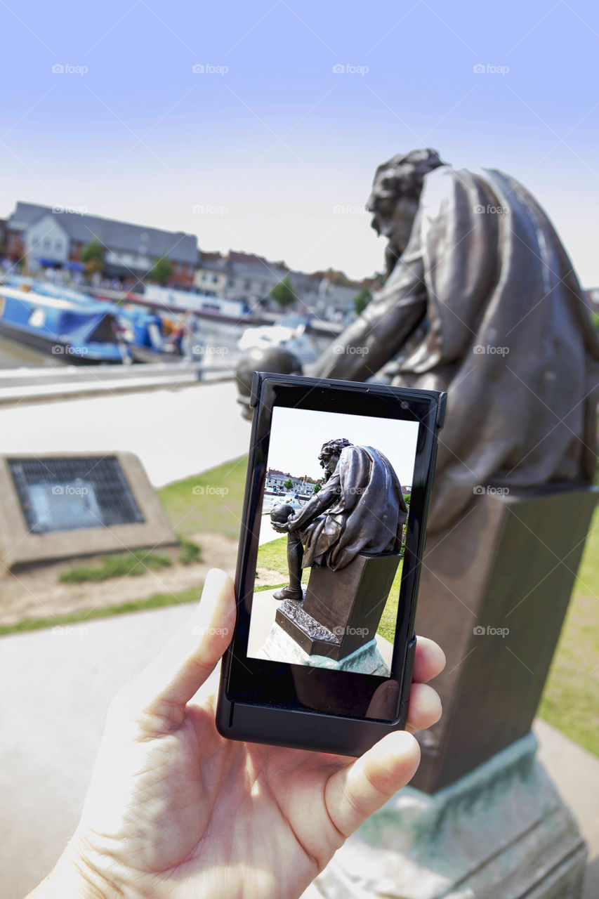 Phone. Camera phoneTourist taking a picture with a smartphone cell phone mobile phone camera 