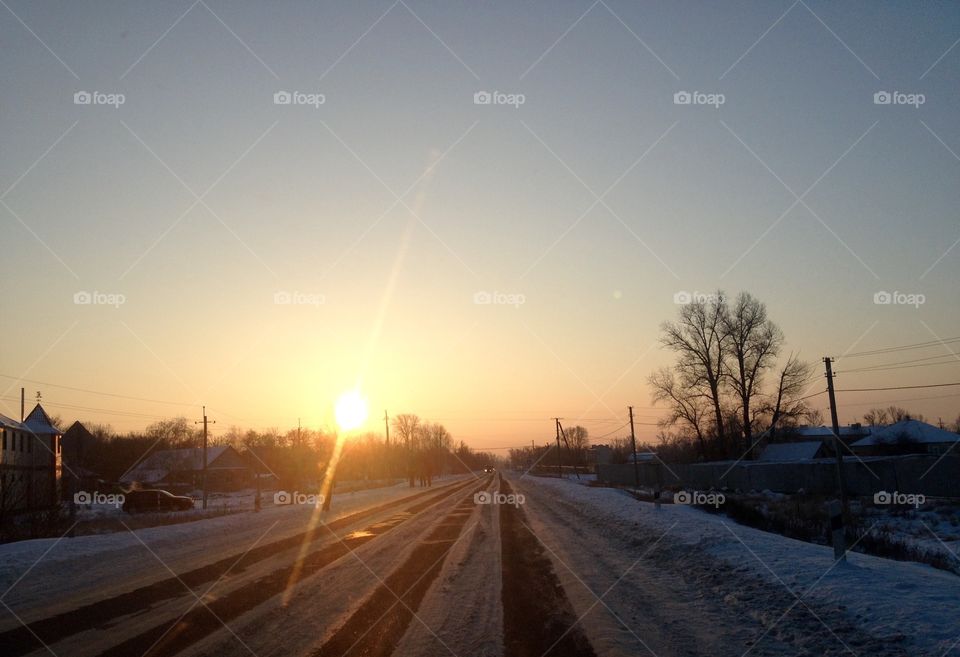 Morning sunset on the village road