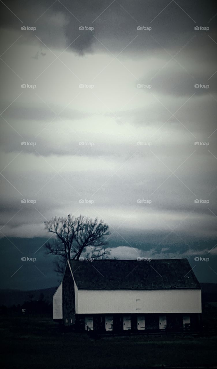 storm clouds over the barn