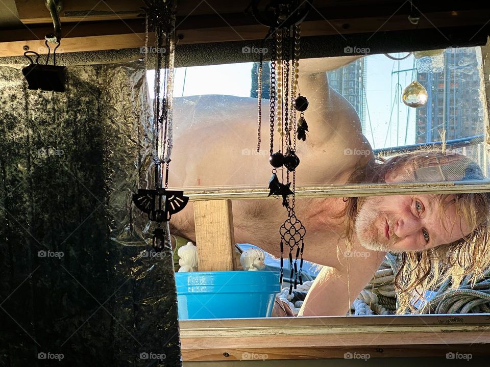 This is my beloved partner & friend “Timothy Trespas” doing some outside repairs to our boat, the “28 foot 1969 Luhrs” at “Newtown Creek” in LIC, Queens we call home. Telling from his smile the job must have been a success. 2023. Hypnotic Productions