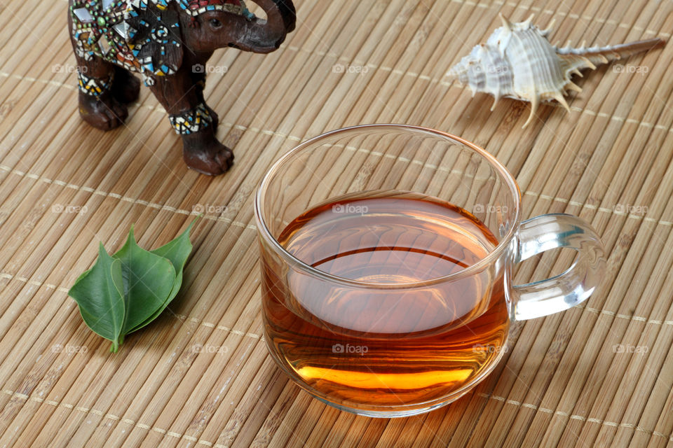 Tea cup worth tea leaves and decorations