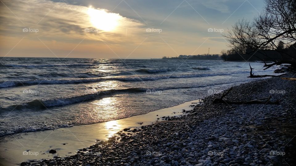Sunset and waves by the lake