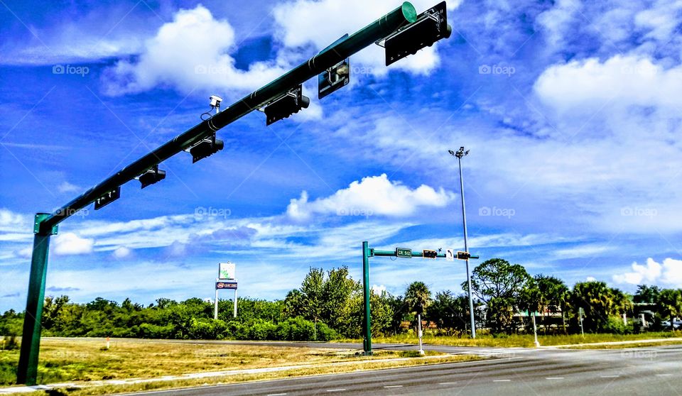 Fellsmere entrance on Interstate 95, Fellsmere, Florida. I love the slow moving clouds across the blue sky