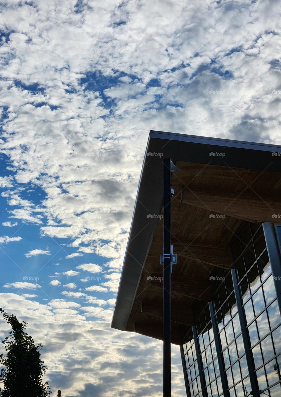 The modern architectural design of this convention center in Oregon features many reflective windows and an angular wooden roof that forms an impressive silhouette