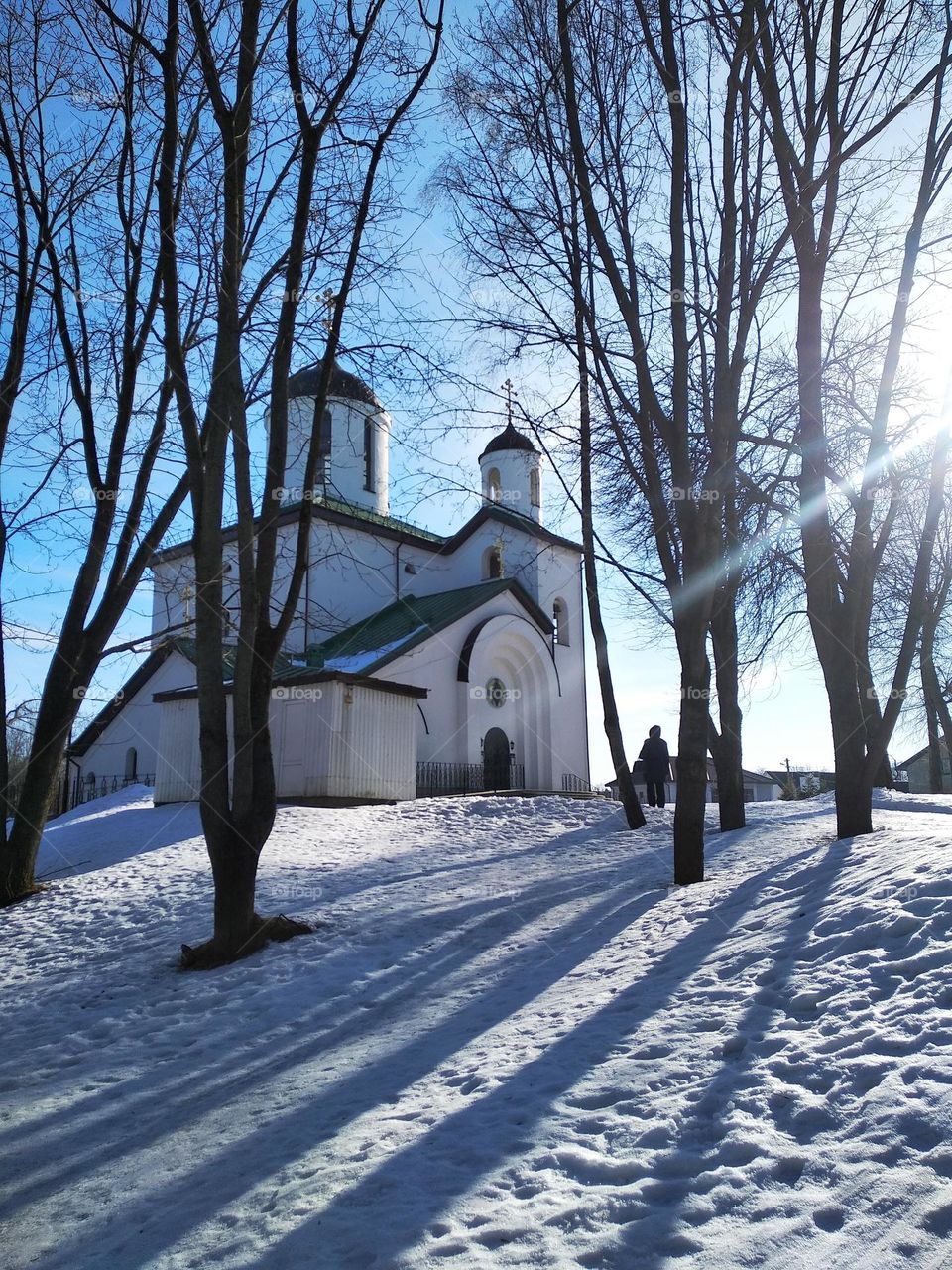 person and church view from the ground