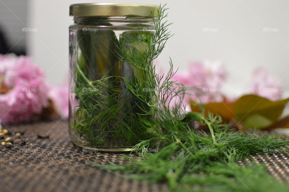 Cucumber pickled jar on table