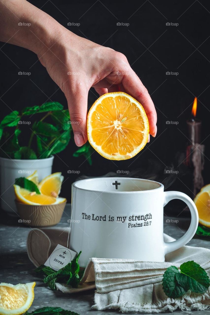 The motivating phrase about God strength on the white tea cup. Help and hope. Vitamins. Pure life