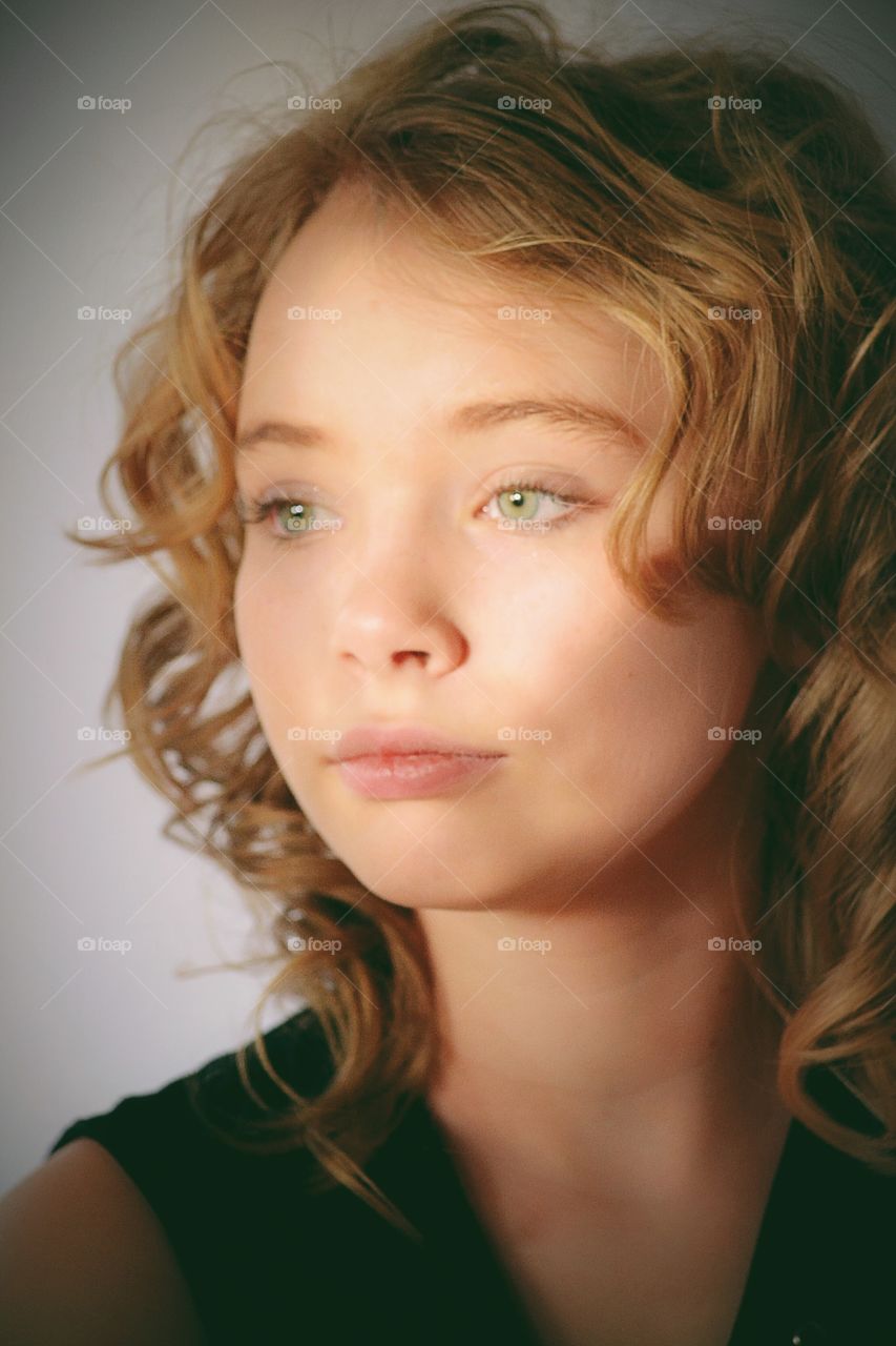 Girl in curly blond hair