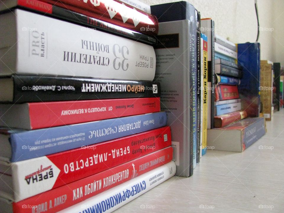 Books on the floor of apartment 