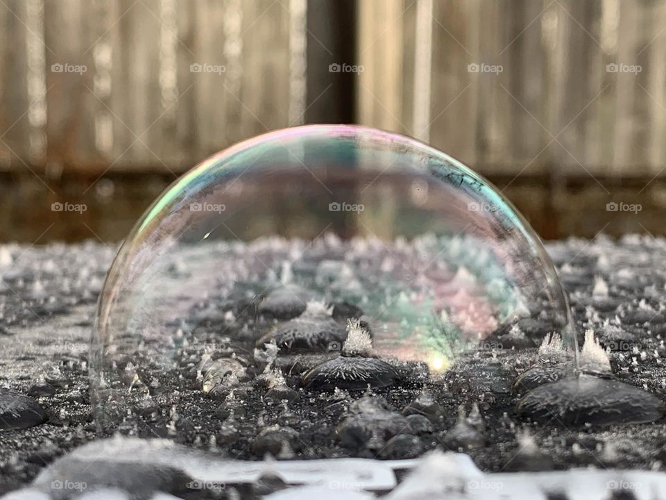 A winter wonderland. Ice crystals on top of a waste bin, on a chilly December morning. A well placed soap bubble on top, for a beautiful effect.