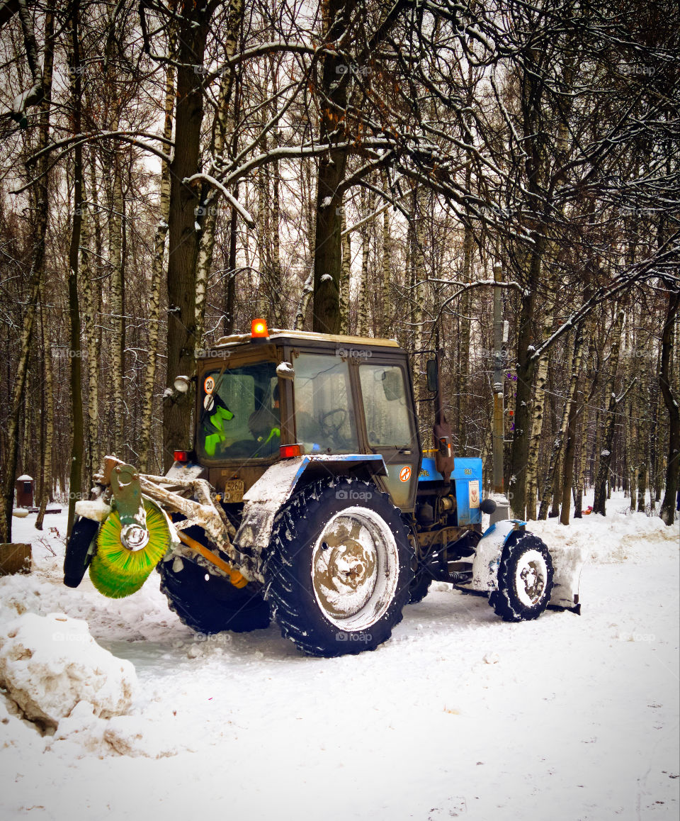 Tractor that removes snow from park paths