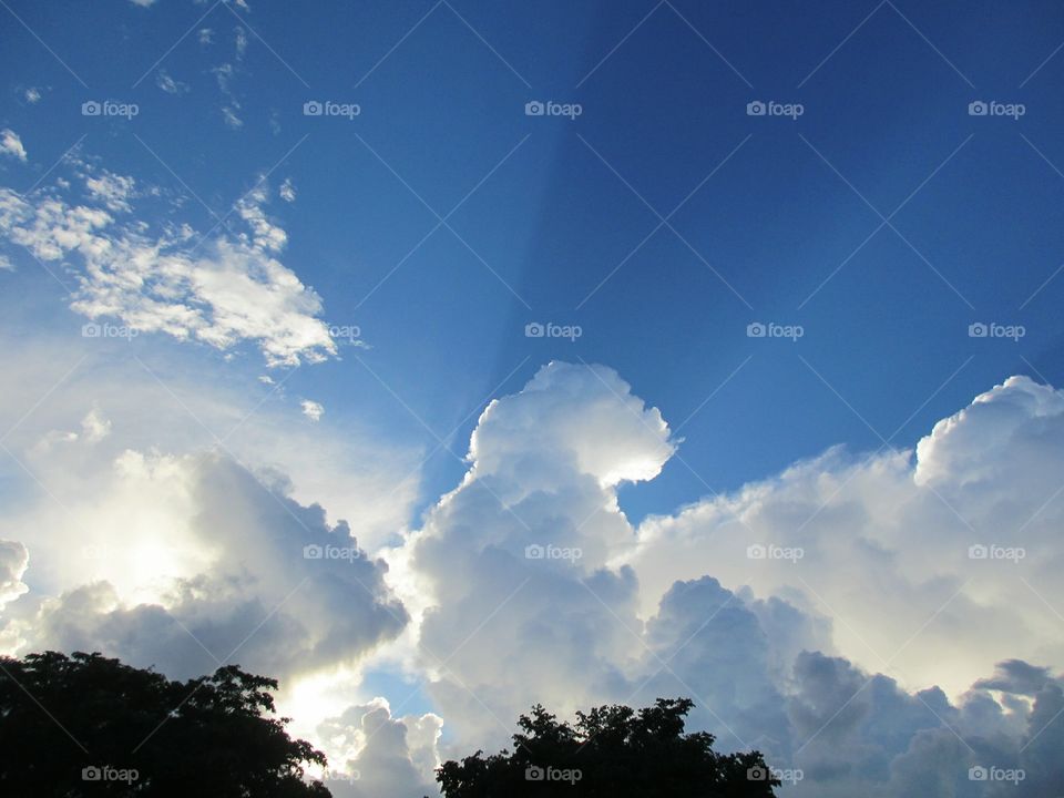 cloud shadows. clouds casting shadows in the blue sky