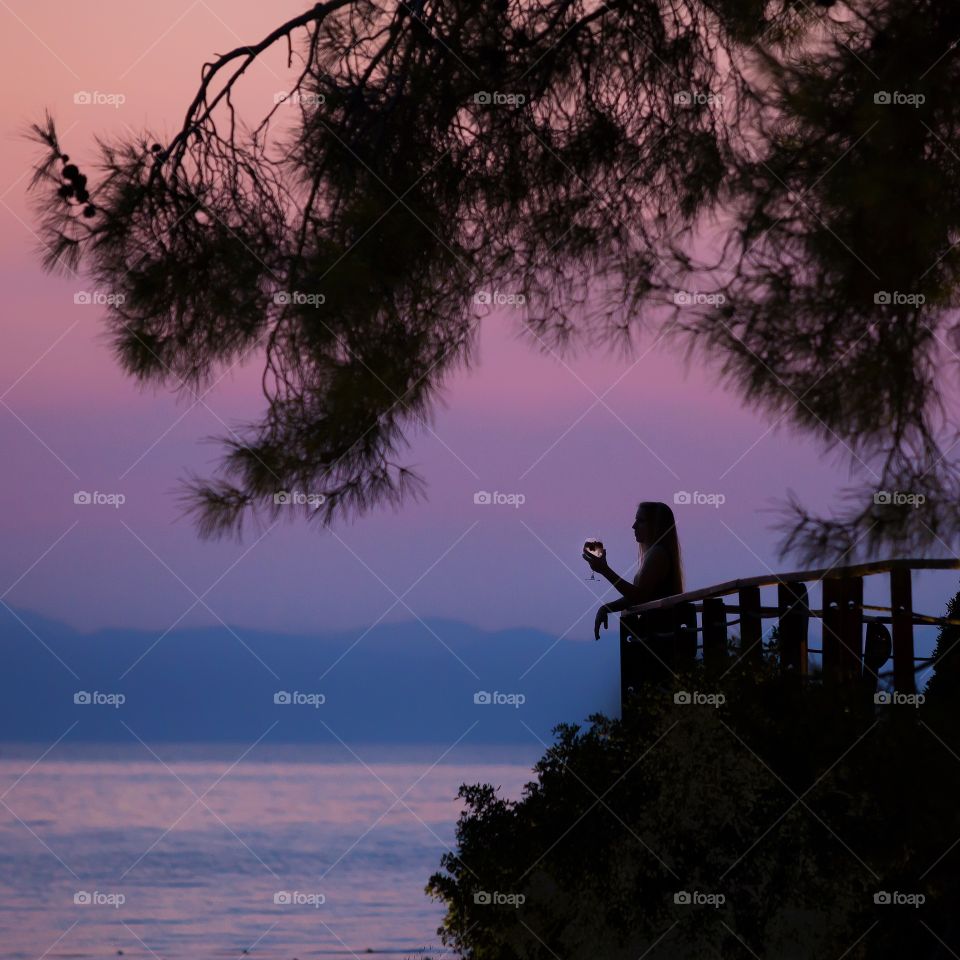 Drinking a cocktail during sunset