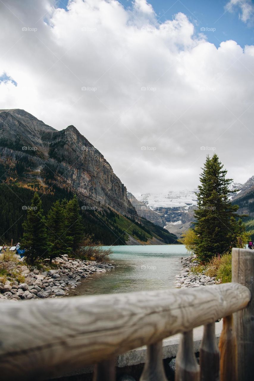 Canadian Rockies mountains in Alberta with blue water and snowy peaks