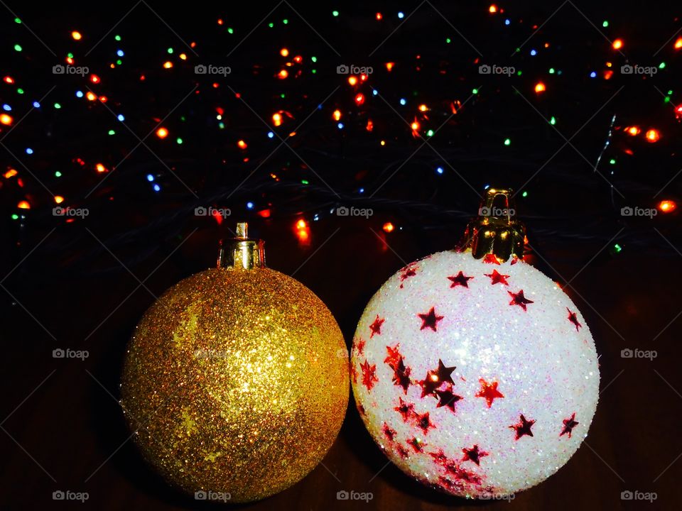 Christmas globes with lights in the background