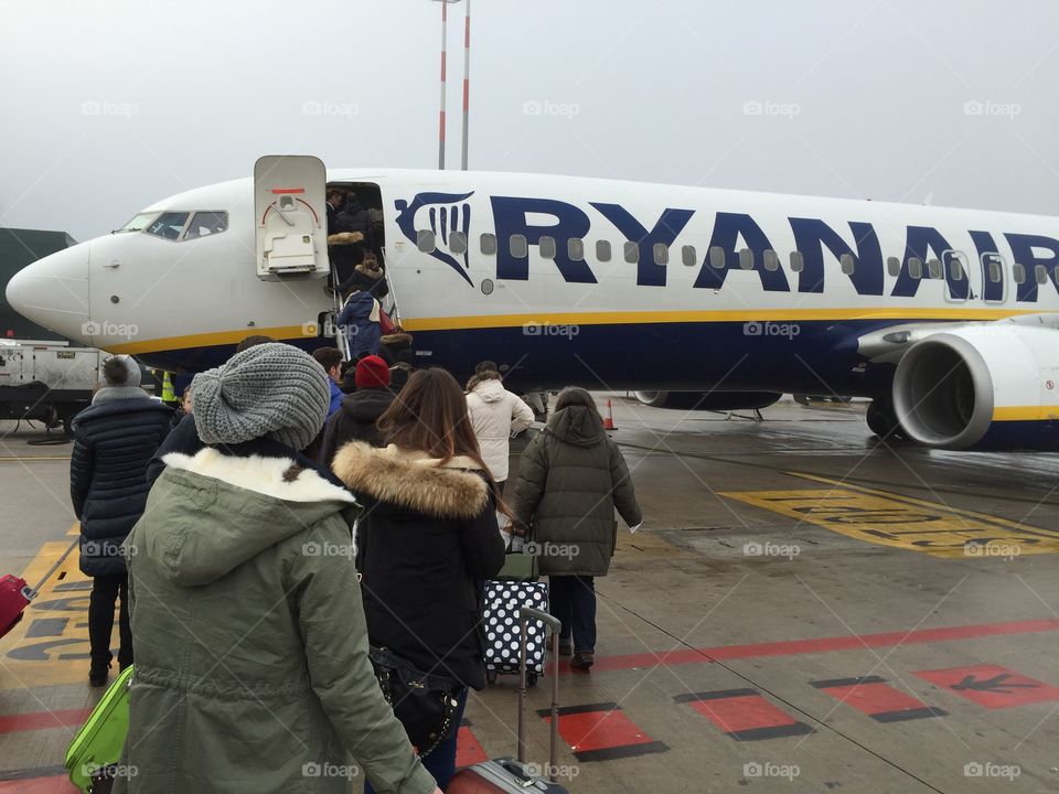 Travelers are boarding the plane