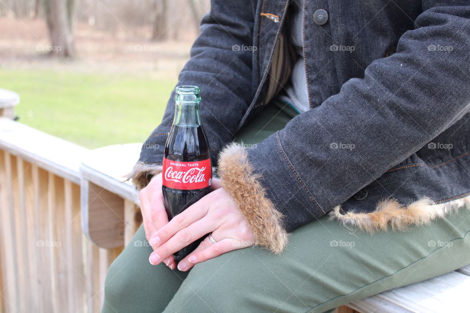 Sitting on a Fence with a Coca Cola