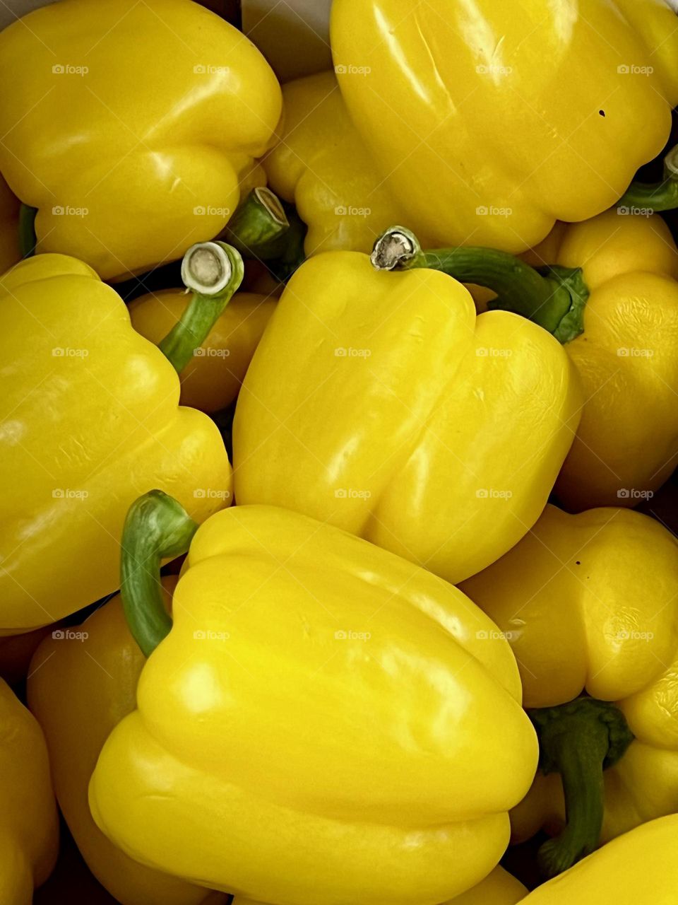 Close-up shot of a yellow pepper in a box. 