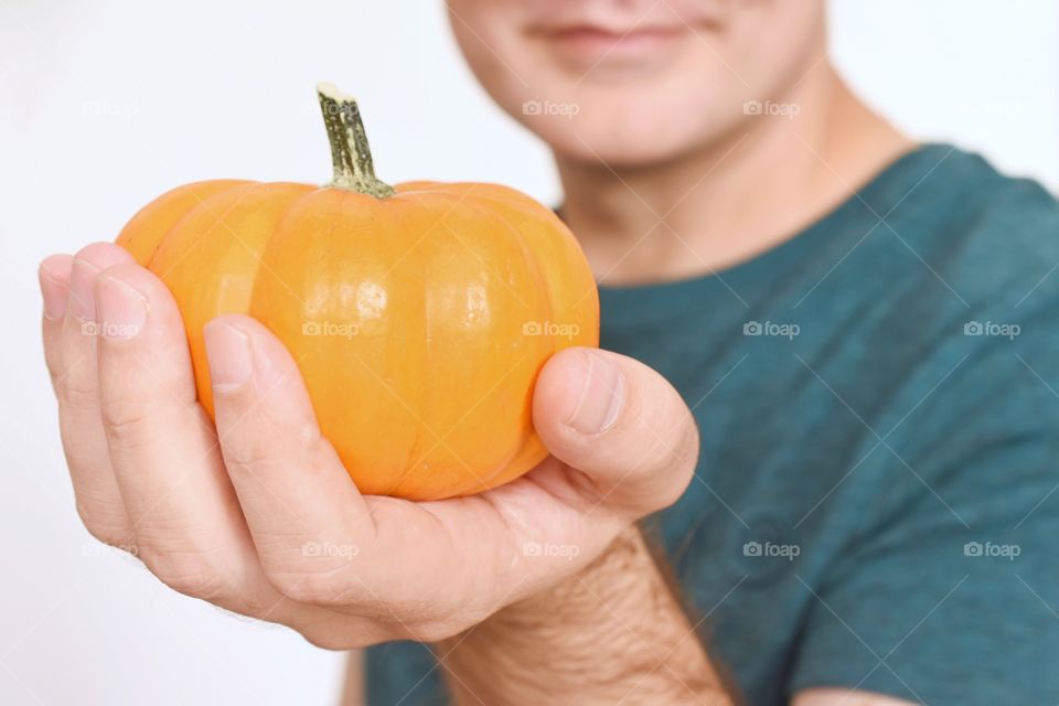 Holding a pumpkin 