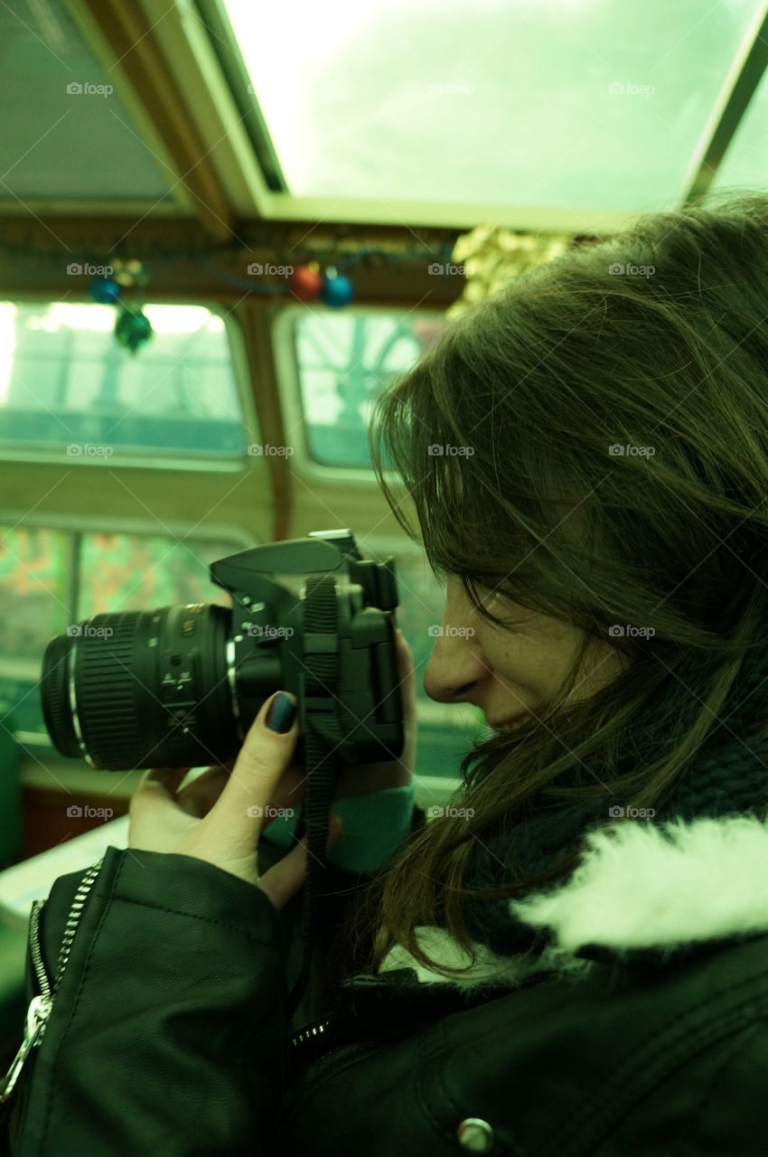 Young girl taking pictures