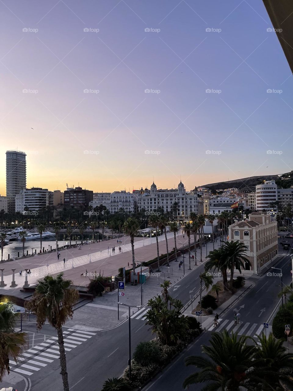 Aerial view of Alicante port promenade at sunset 