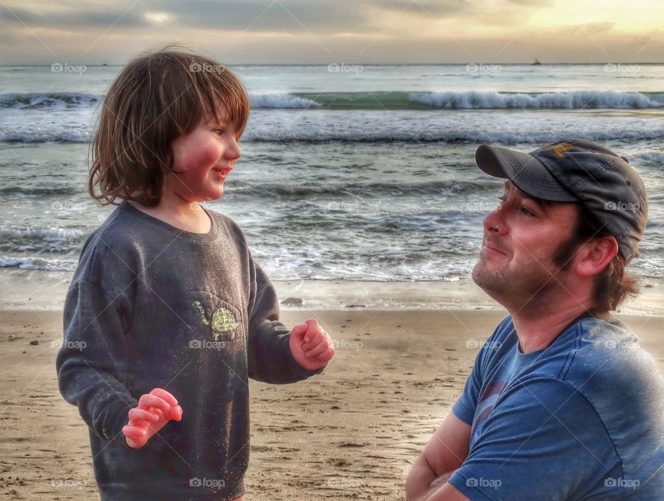 Proud Father With Son. Father And Son At The Beach During The Golden Hour
