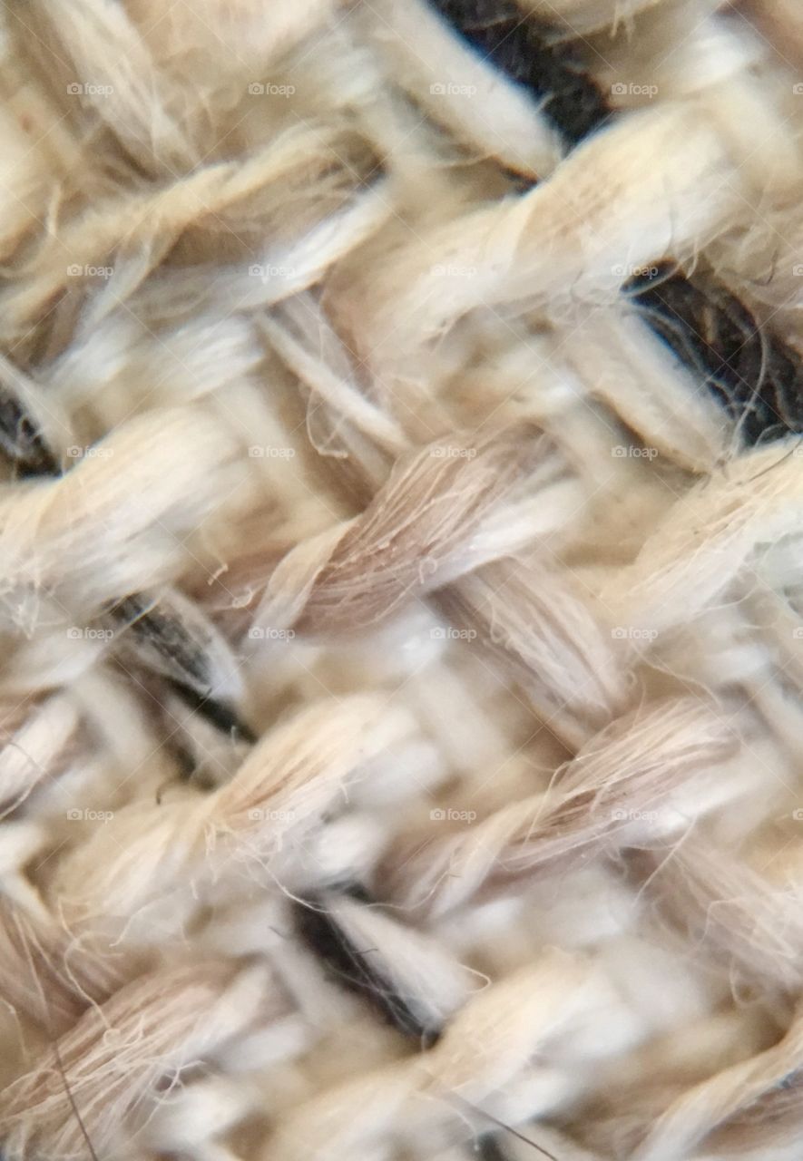 Microscopic view of tweed fabric earth tones