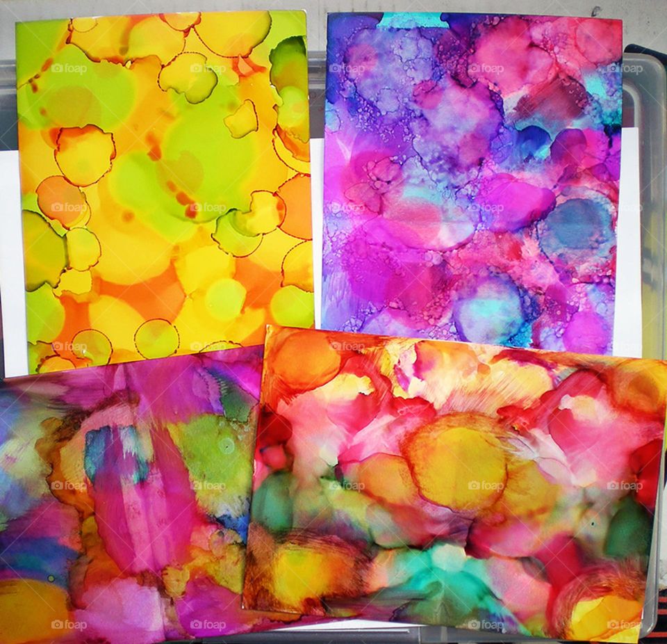 brightly colored handmade alcohol ink glossy background art papers for crafting project possibilities