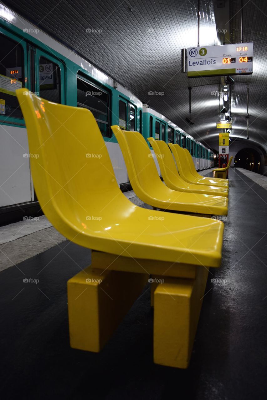 Yellow seats brighten up a metro tunnel in Paris. October 2016.