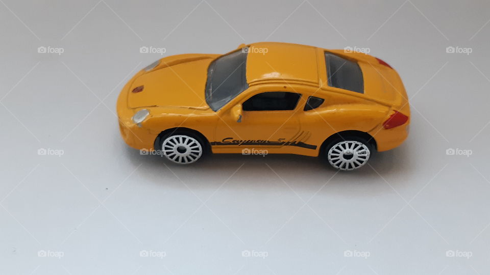 Yellow porsche cayenne toy