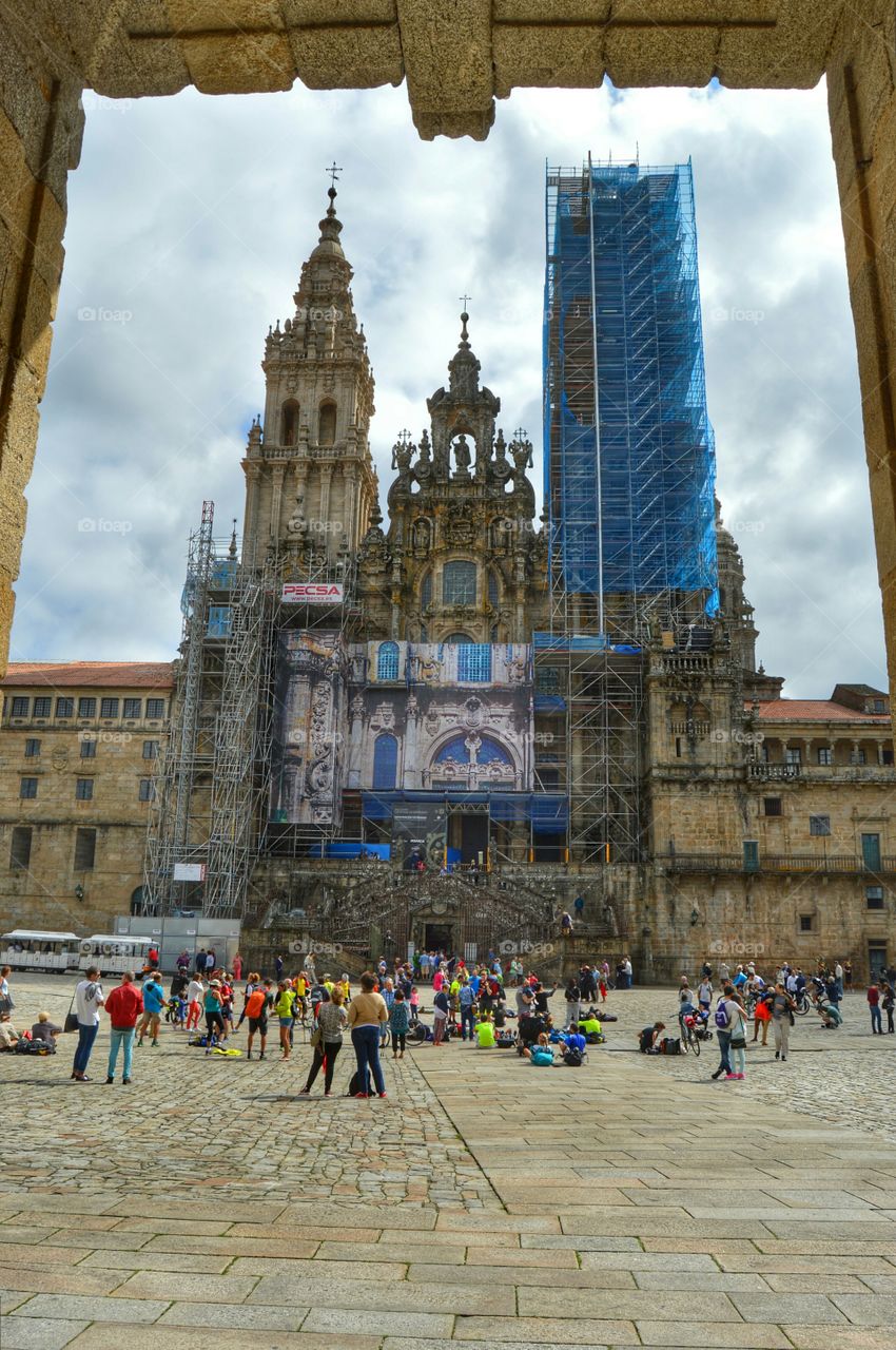 Santiago de Compostela. Pilgrims at Obradoiro Square and view of the cathedral from Pazo de Raxoi