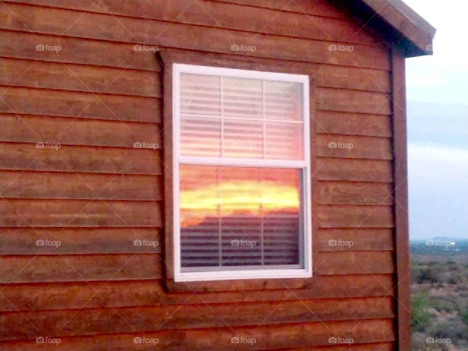Sunset reflection in house window
